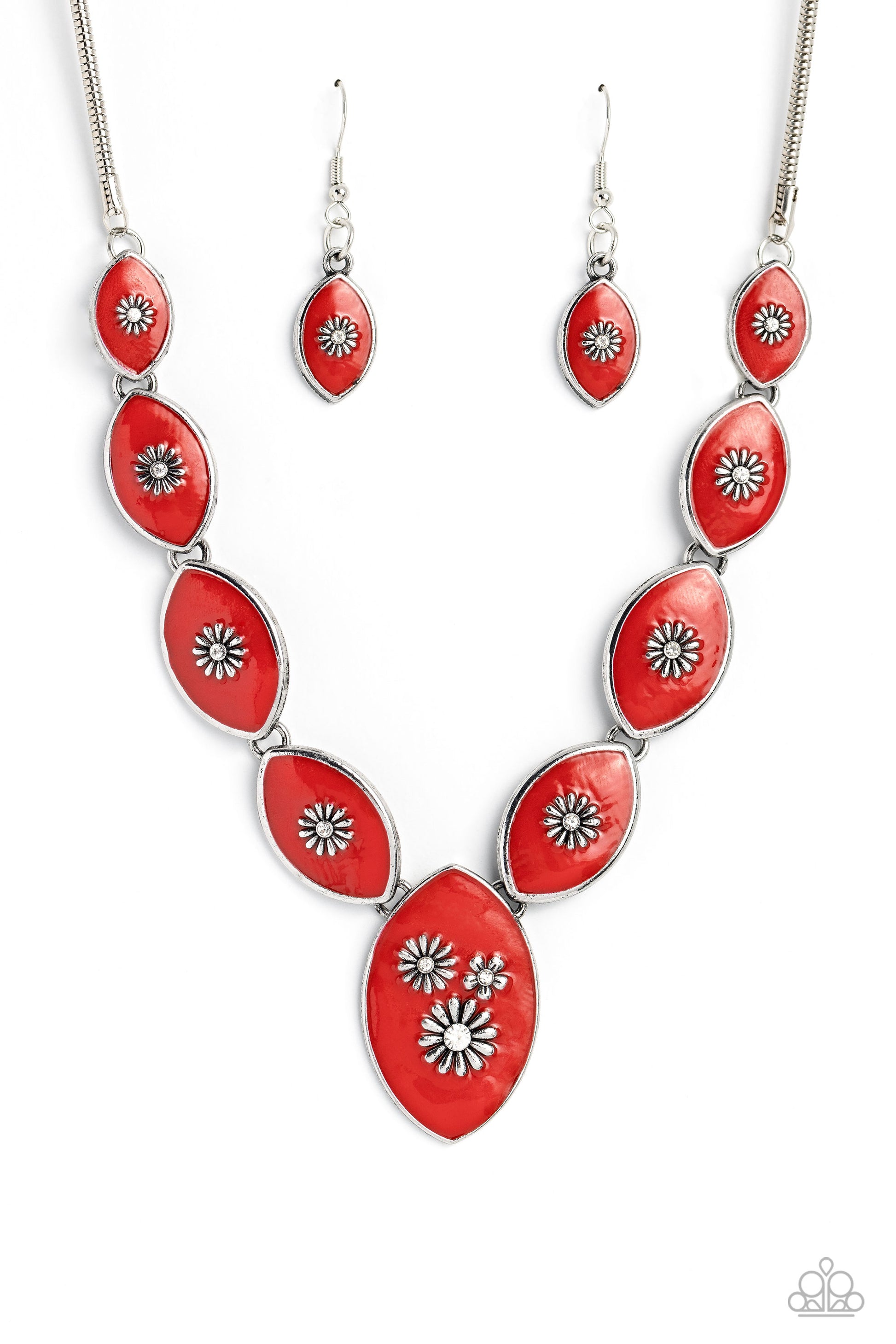 Featuring vibrant red paint, a collection of silver marquise-shaped frames gradually increase in size as they taper below the collar in a timeless fashion on a silver snake chain. Each frame is embossed with a delicate silver flower with a white rhinestone center, with the centermost pendant featuring three flowers, creating a glamorous array of whimsicality. Features an adjustable clasp closure.